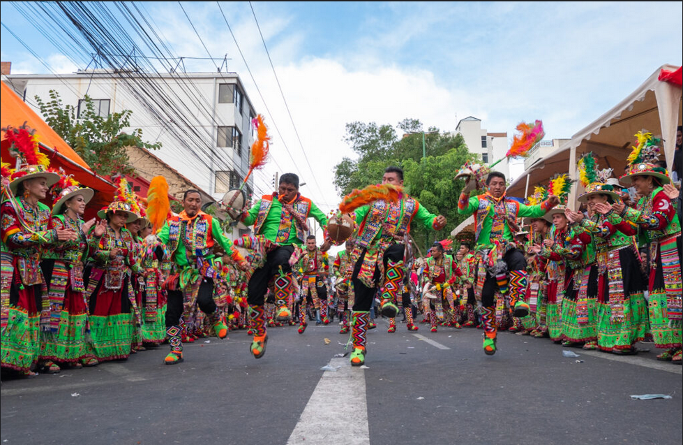 Dancer showcasing fluid movements of Rzinho dance on a colorful Brazilian street.